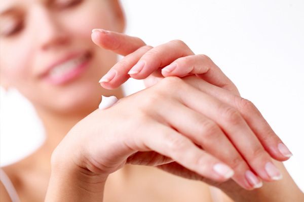 woman applying cream