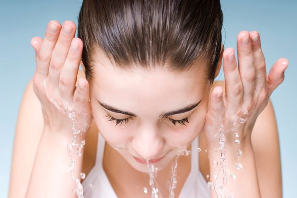 woman washing face